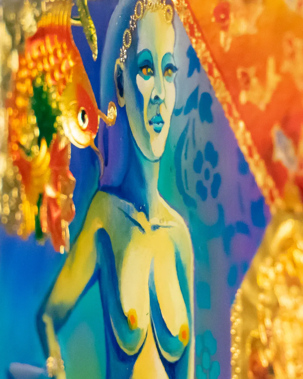 Detail: a face and the golden fish